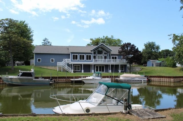 dock area featuring a yard and a water view