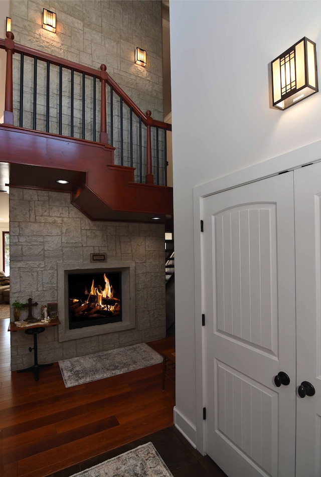 interior space with a fireplace and dark wood-type flooring