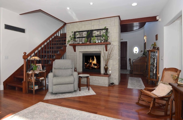 living room with a fireplace and hardwood / wood-style floors