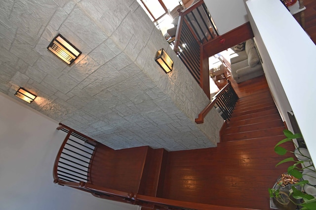 stairway with brick ceiling