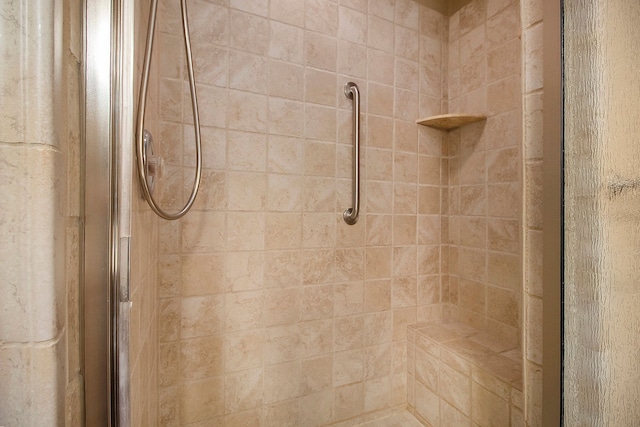 bathroom with a shower with shower door