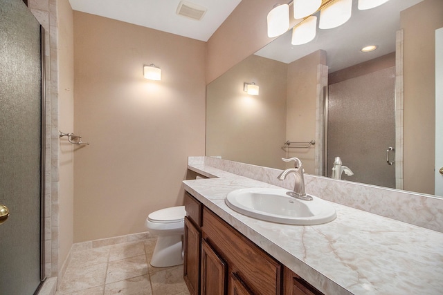 bathroom featuring walk in shower, vanity, and toilet