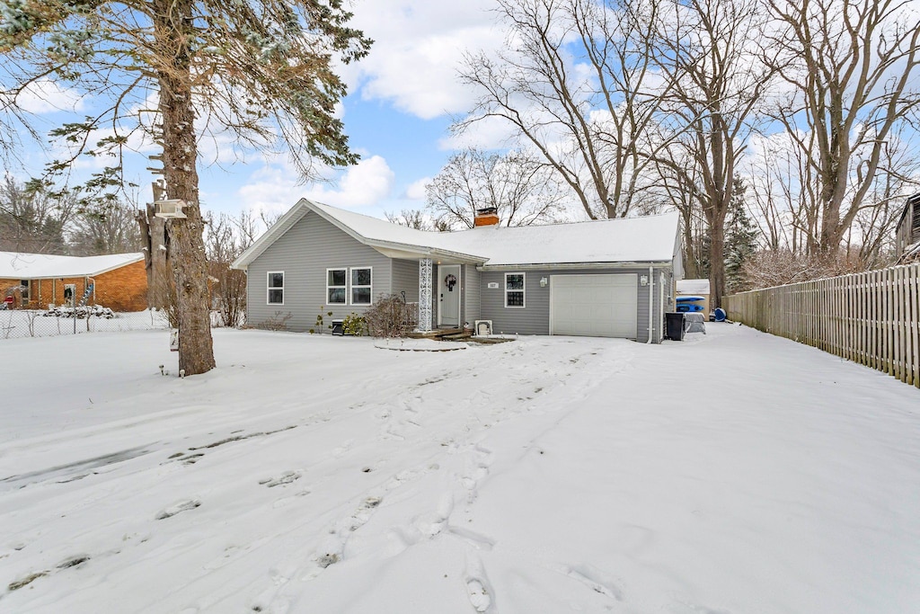 ranch-style home featuring a garage