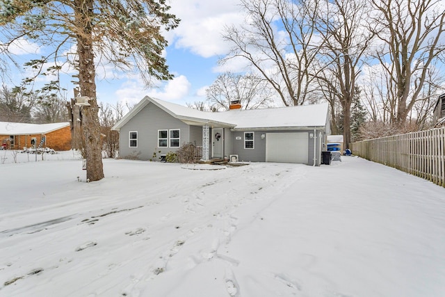 ranch-style home featuring a garage