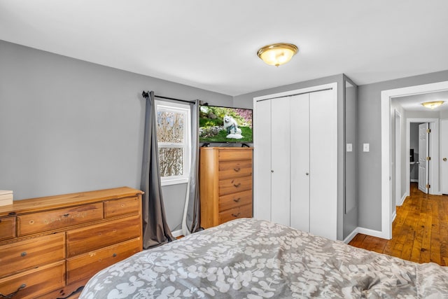 bedroom featuring a closet and hardwood / wood-style flooring