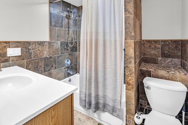 full bathroom with shower / tub combo with curtain and tile walls