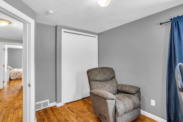 sitting room featuring light wood-type flooring