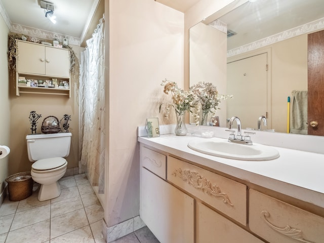 bathroom featuring crown molding, vanity, toilet, and tile patterned flooring