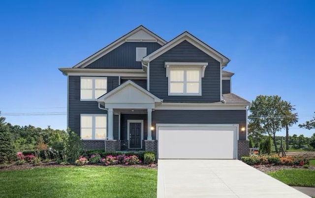 craftsman inspired home featuring a garage and a front yard