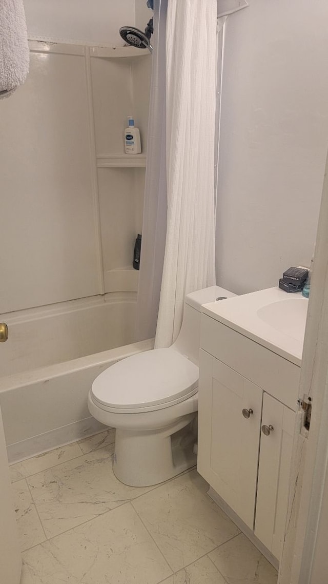 full bathroom featuring vanity, shower / bath combo, and toilet