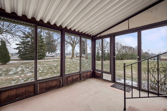 unfurnished sunroom with vaulted ceiling