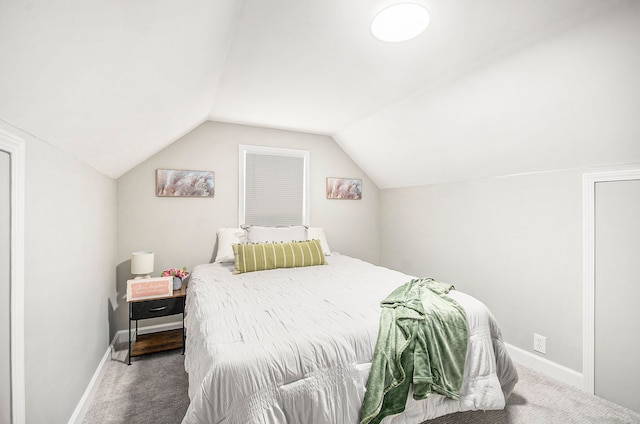 bedroom with carpet and vaulted ceiling