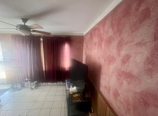 spare room featuring light tile patterned floors and ceiling fan