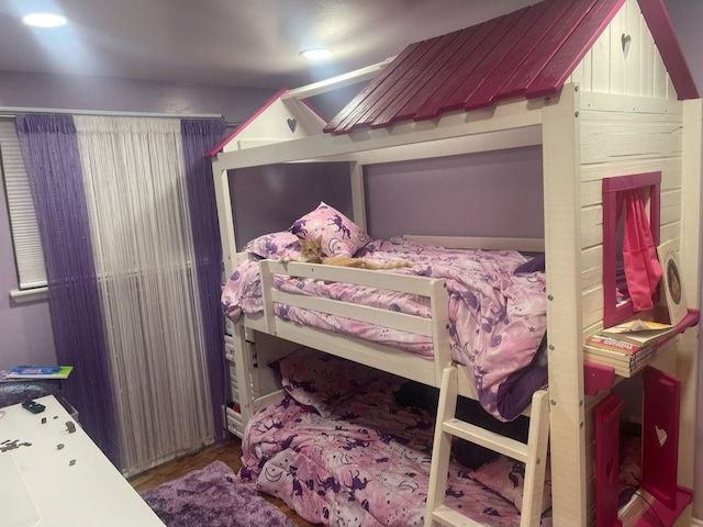 bedroom with wood-type flooring