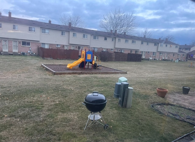 view of jungle gym featuring a lawn