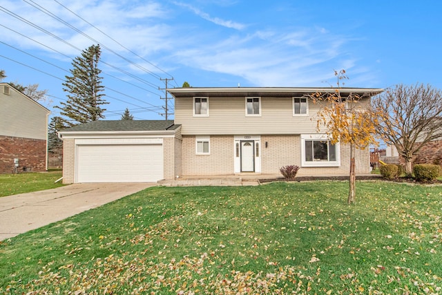 view of property with a front lawn and a garage