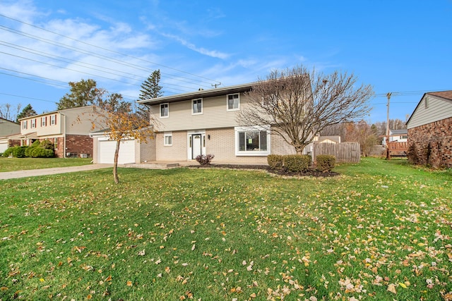 view of front facade with a front lawn and a garage