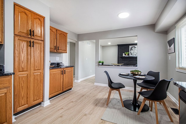 dining space featuring light hardwood / wood-style floors