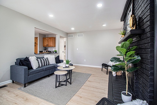 living room with light hardwood / wood-style floors