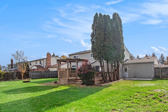 view of yard with a pergola and a deck