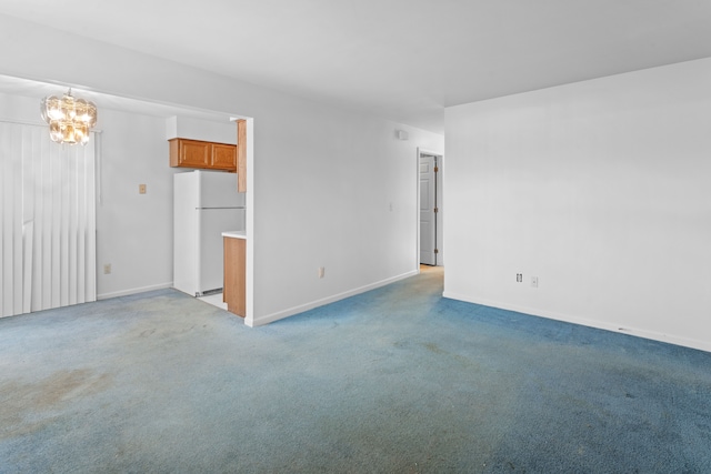 unfurnished living room with light carpet and a chandelier