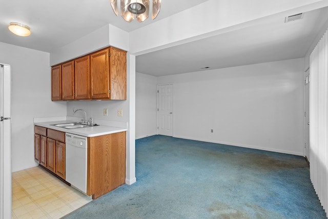 kitchen with a chandelier, white dishwasher, light colored carpet, and sink