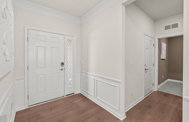 entryway featuring dark hardwood / wood-style floors and ornamental molding