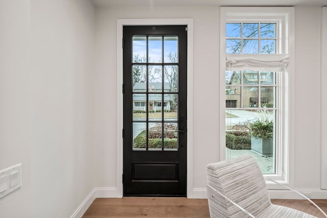 doorway with light hardwood / wood-style floors