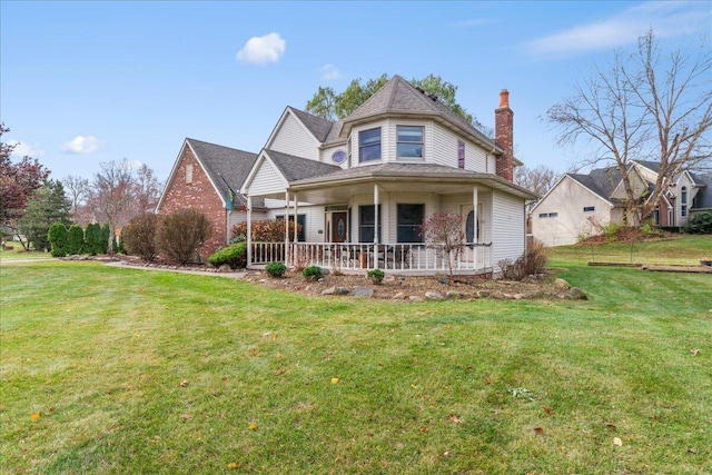 view of front of property featuring a porch and a front lawn