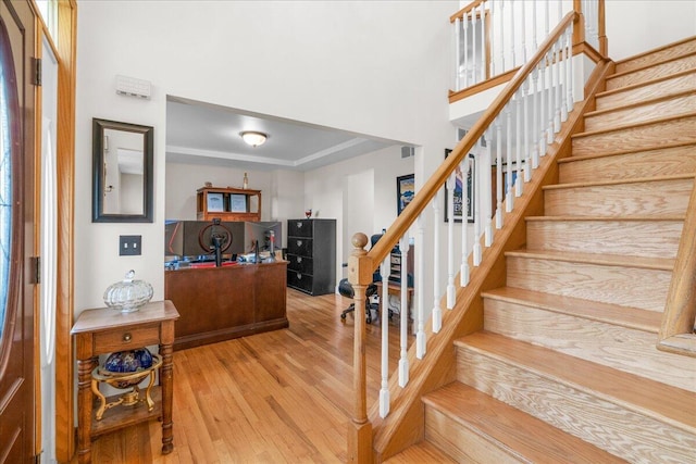 staircase featuring hardwood / wood-style flooring