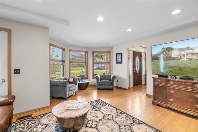 living room with light hardwood / wood-style floors