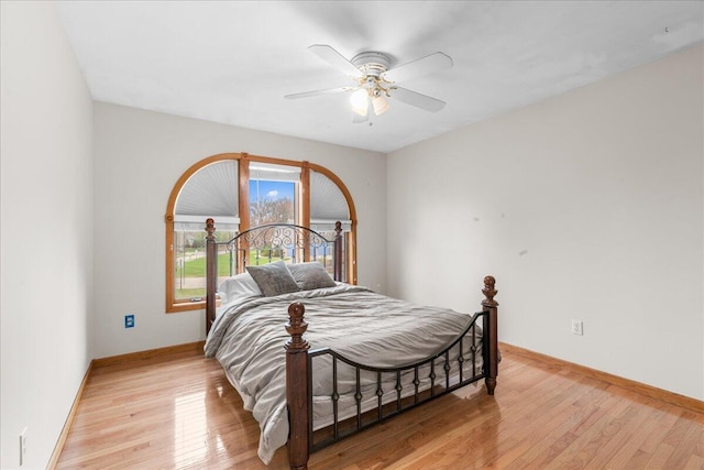 bedroom featuring light wood-type flooring and ceiling fan