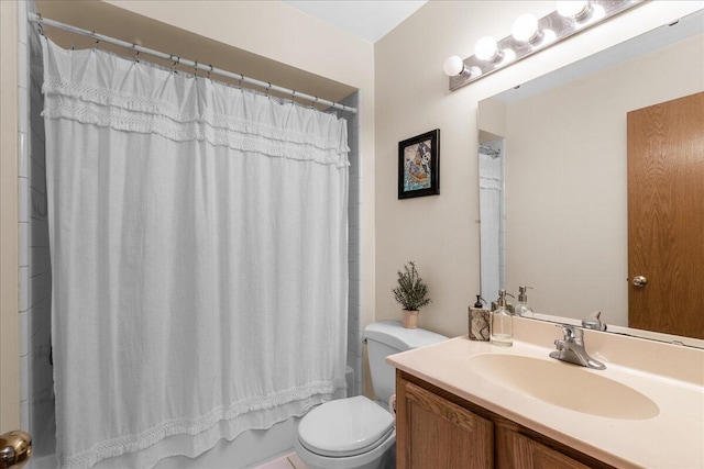 full bathroom with vanity, shower / bath combo with shower curtain, and toilet