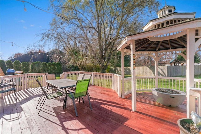 wooden terrace featuring a gazebo and a mountain view