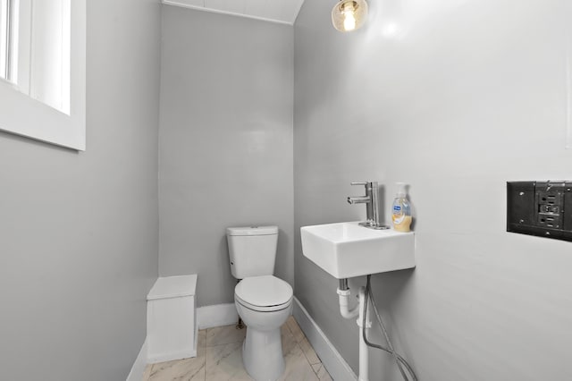 bathroom with sink and toilet