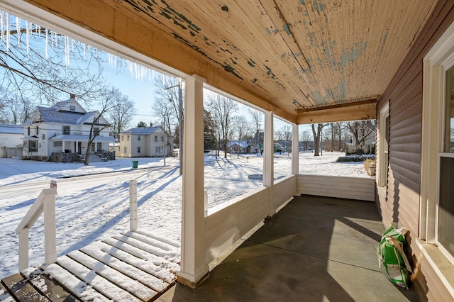 sunroom / solarium featuring plenty of natural light and wood ceiling