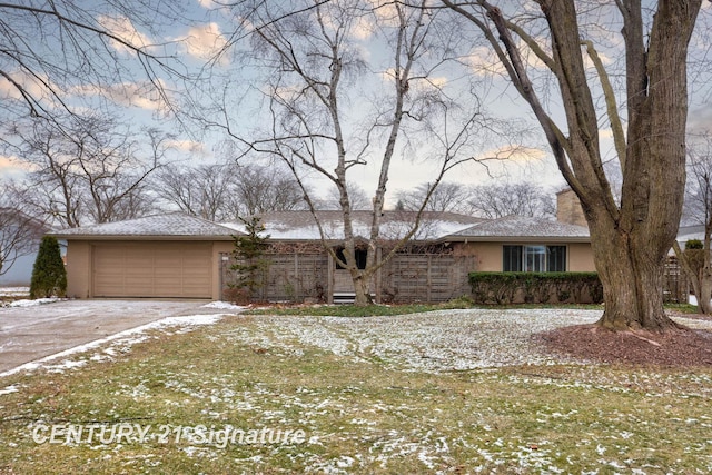 ranch-style house featuring a garage