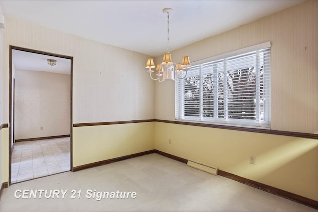 unfurnished room featuring a chandelier