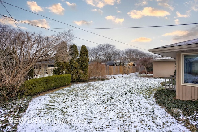 view of yard covered in snow