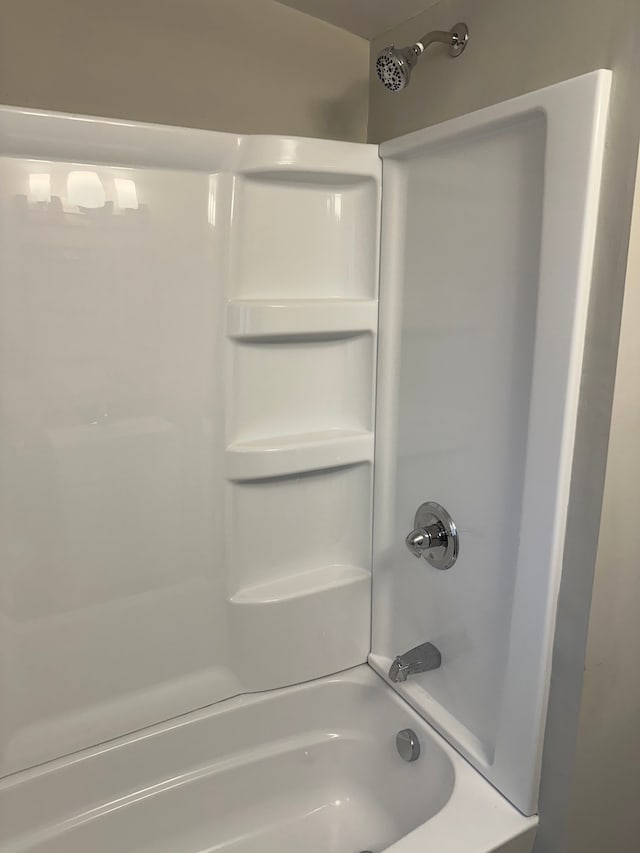 bathroom featuring washtub / shower combination