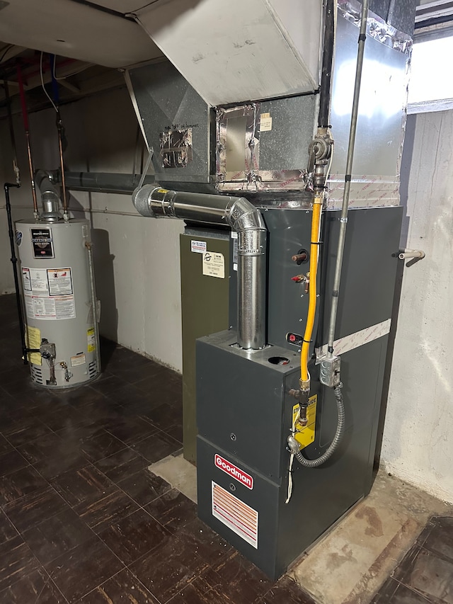 utility room featuring gas water heater