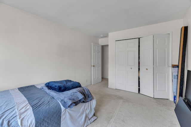 carpeted bedroom with a closet