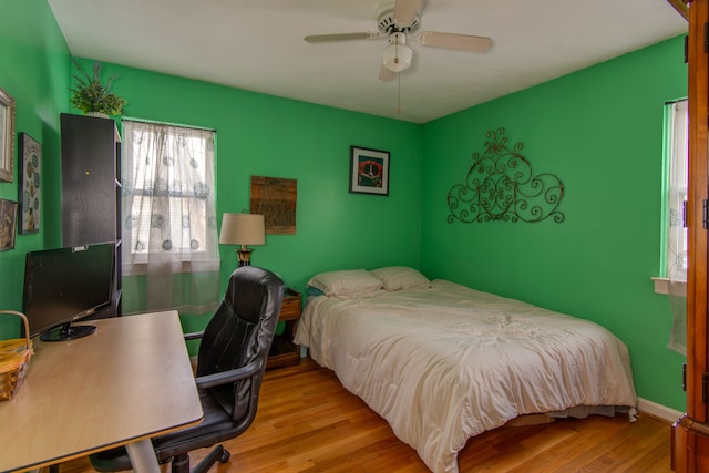 bedroom featuring ceiling fan and light hardwood / wood-style floors