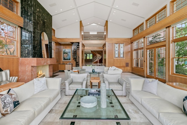 interior space with a high ceiling and wooden walls