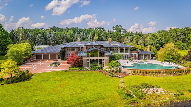 back of house featuring a patio area and a lawn