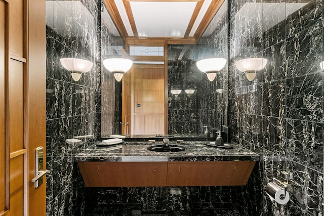 bathroom with vanity, tile walls, and ornamental molding