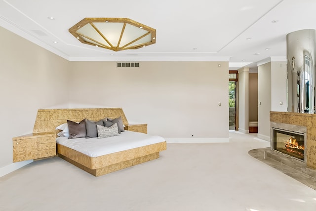 bedroom featuring a fireplace and ornamental molding