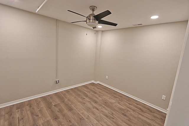 empty room featuring hardwood / wood-style flooring and ceiling fan