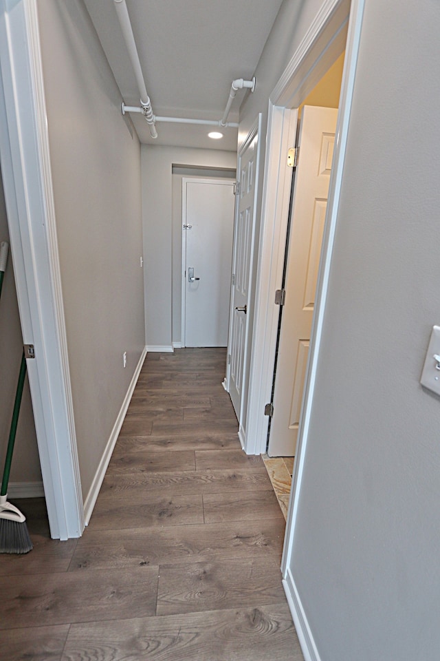 hallway featuring dark wood-type flooring