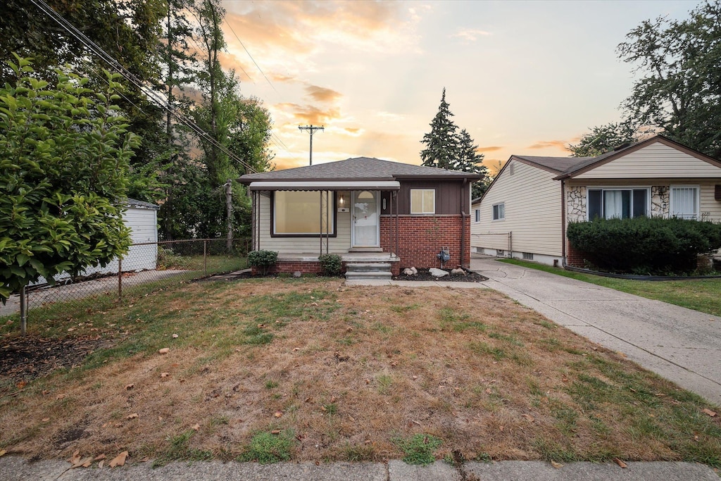 view of front of home with a yard